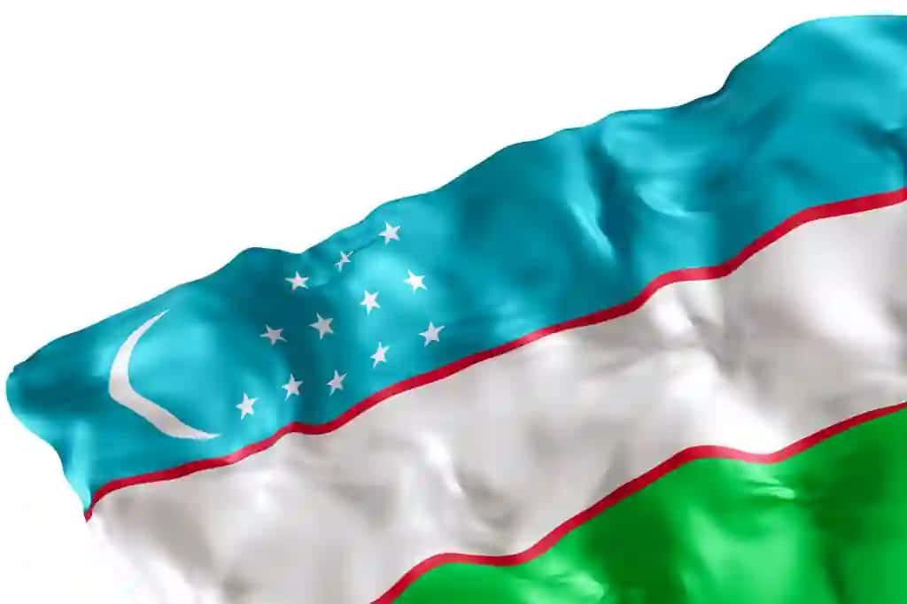 O'zbekistonning haqiqiy bayrog'i burmalangan oq fon ostida joylashgan burchakli dizayn elementi mukammal vatanparvarlik mavzularidagi milliy tadbir reklamalari 3D render | Realistic flag uzbekistan with folds isolated white background footer corner design element cut out perfect patriotic themes national event promotions 3d render