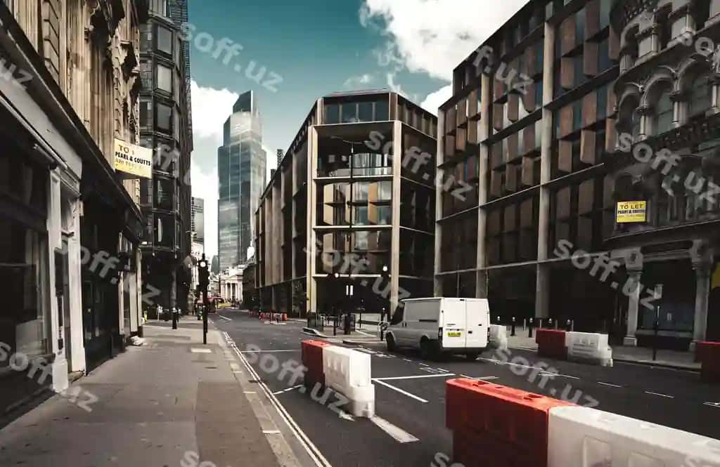 Yolg'iz furgon shahar kochasi binolar o'rtasida osmon qarshi | Lone van city street amidst buildings against sky