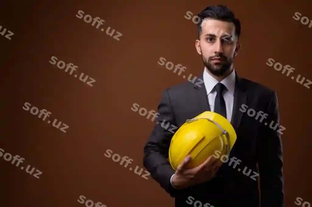 Yosh, kelishgan, soqolli eronlik biznesmen, qarshisida qattiq shlyapa kiygan | Young handsome bearded iranian businessman with hardhat against